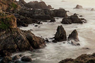 Scenic view of rocks in sea
