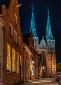 Illuminated buildings in city at night