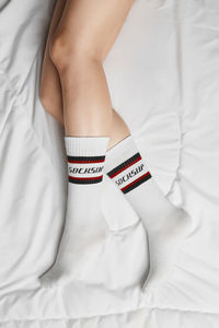 High angle view of woman lying on bed