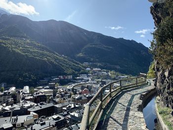 High angle view of townscape and mountains against sky