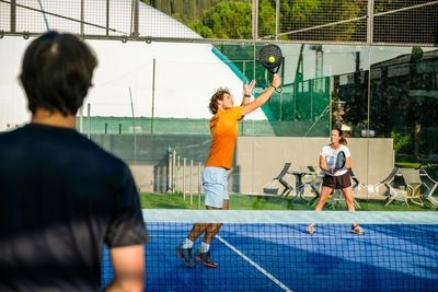 Tennis player playing at court