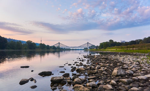 Bridge over river against sky