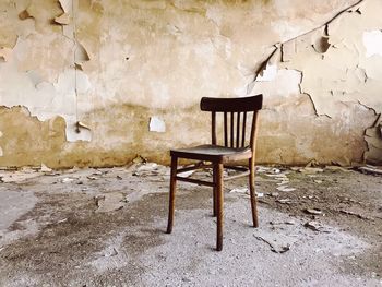 Wooden chair in abandoned house