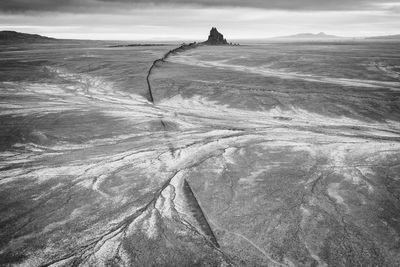 Scenic view of shiprock, nm against sky