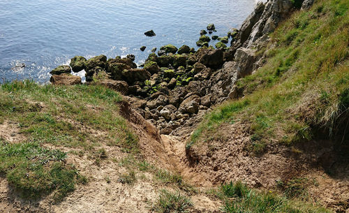 High angle view of rocks by sea