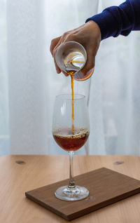 Close-up of wineglass on table