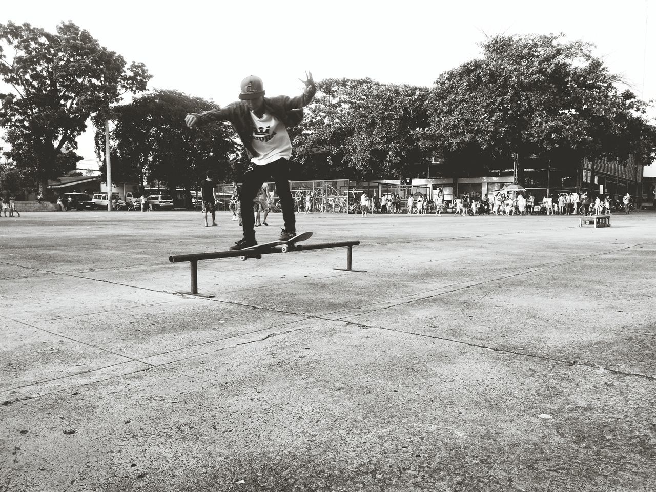 YOUNG WOMAN PLAYING IN PARK