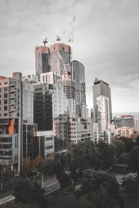 Buildings in city against sky