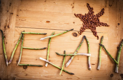 High angle view of asparagus and beans on table