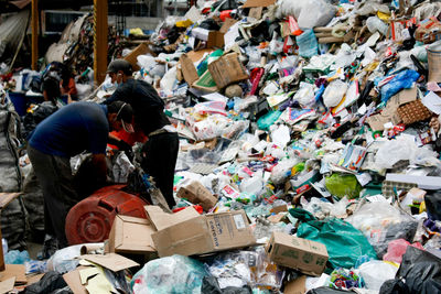 Man with garbage in background