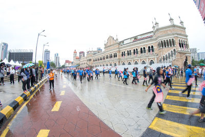 Group of people walking on city street