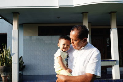 Grand father and son at home