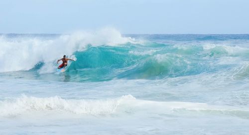 People surfing in sea