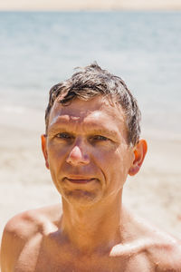 Portrait of shirtless man at beach