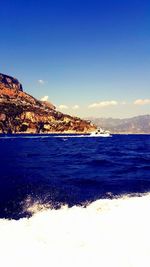 Scenic view of sea against blue sky