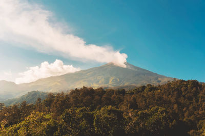 Scenic view of volcanic mountain against sky