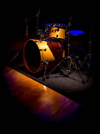 Illuminated guitar against black background