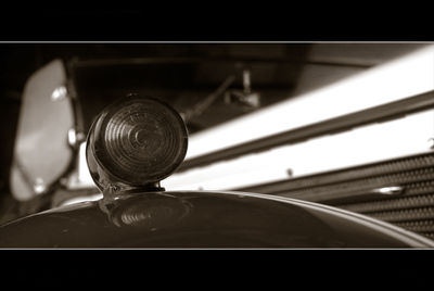 Close-up of car on road