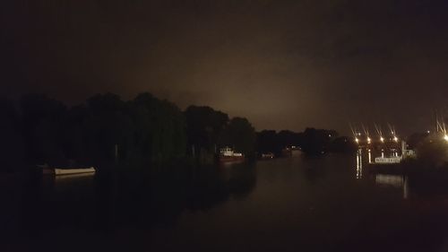 Reflection of illuminated sky on water at night