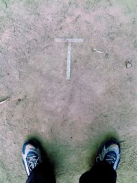 Low section of man standing on floor