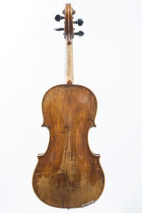 Close-up of cross on wood against white background