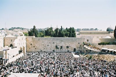 Many jews pray at the western wall on a jewish holiday