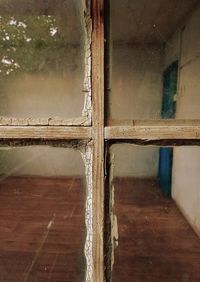 Close-up of old window of abandoned building