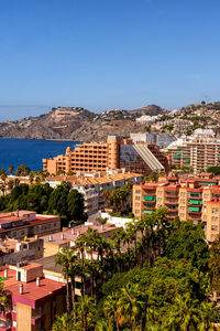 High angle view of townscape against clear blue sky