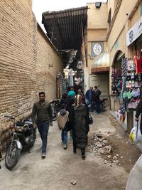 People walking on street market in city