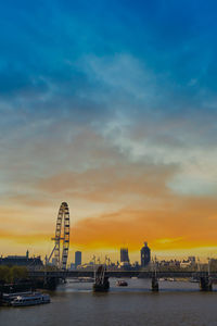 View of ferris wheel at sunset