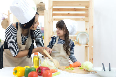 Girl holding ice cream at home