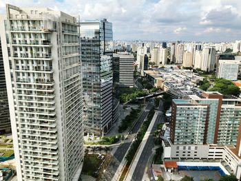 High angle view of buildings in city against sky