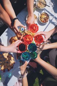 High angle view of friends eating outdoors