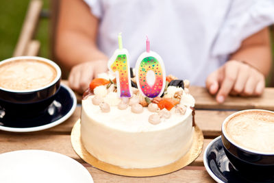 Close-up of cake with coffee served on table