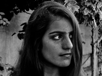 Close-up of young woman looking away