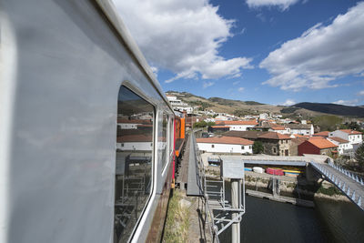 Panoramic view of buildings in city against sky