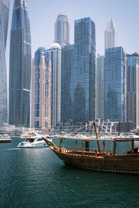 Boats in sea against sky