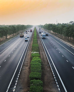 Cars on road against sky