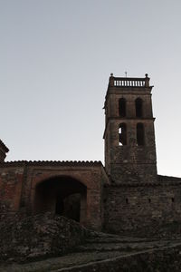 Low angle view of bell tower against clear sky