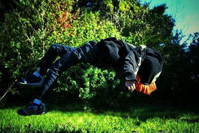 People walking on grassy field