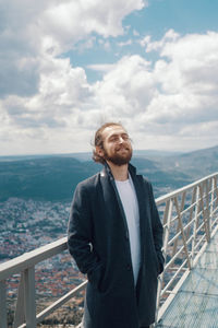 Man looking at sea against sky