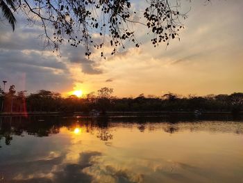 Scenic view of lake against sky during sunset