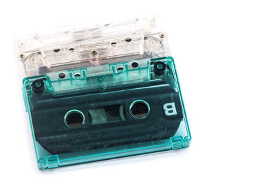 Close-up of old telephone over white background