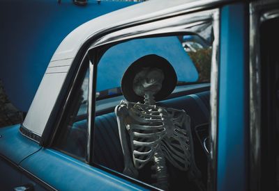 Skeleton in vintage car