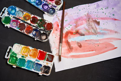 High angle view of paintbrushes on table
