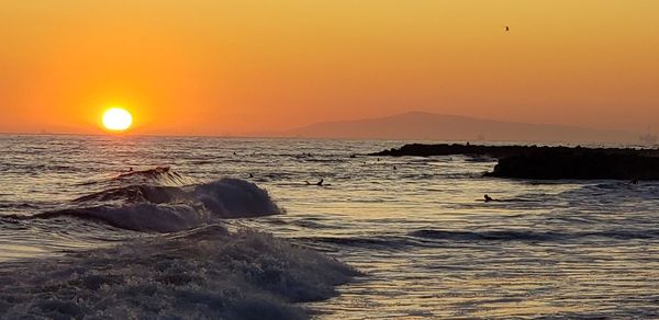 Scenic view of sea against sky during sunset