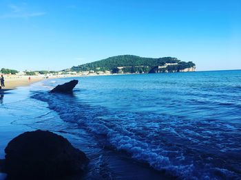 Scenic view of sea against clear blue sky