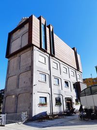 Low angle view of building against clear blue sky