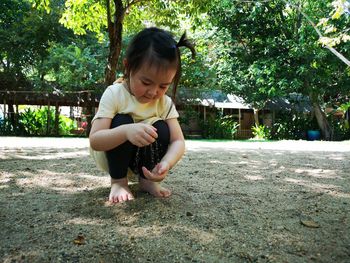 Full length of woman looking at camera