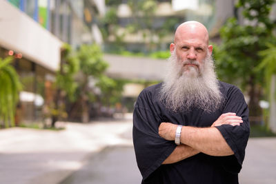 Portrait of man standing outdoors